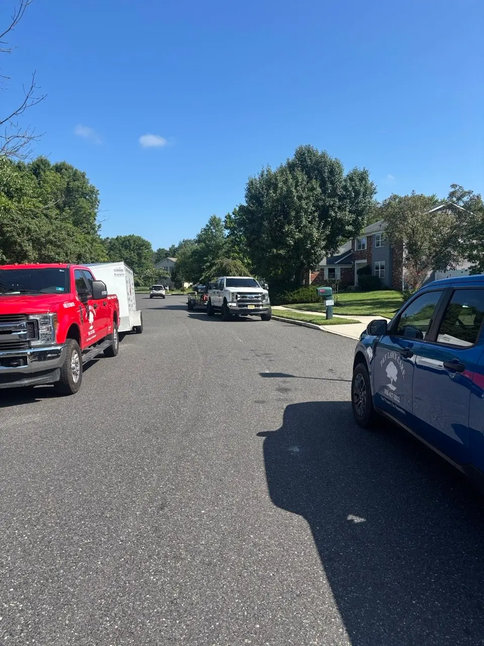 P&F Lawn Care trucks on a job in Cherry Hill, NJ
